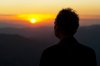 man_looking_into_sunset.jpg